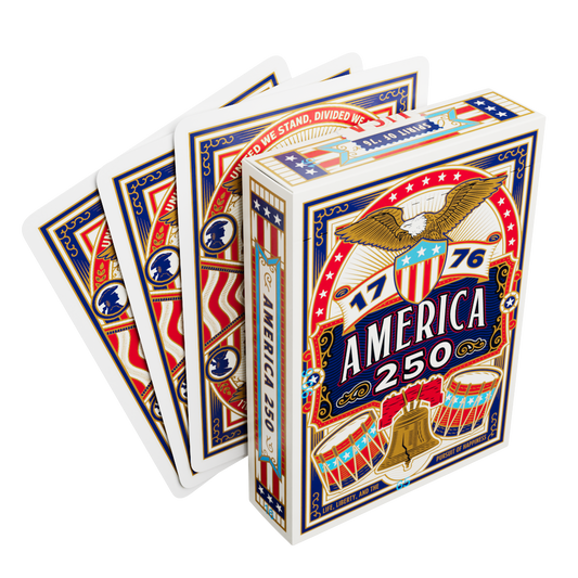 Remembrance America 250 playing card tuck box displayed with several cards showing the patriotic card back design.