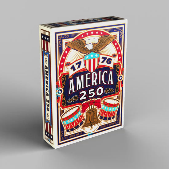 Rotating product view of the Remembrance America 250 playing card tuck box showing the front, back, sides, top, and bottom.
